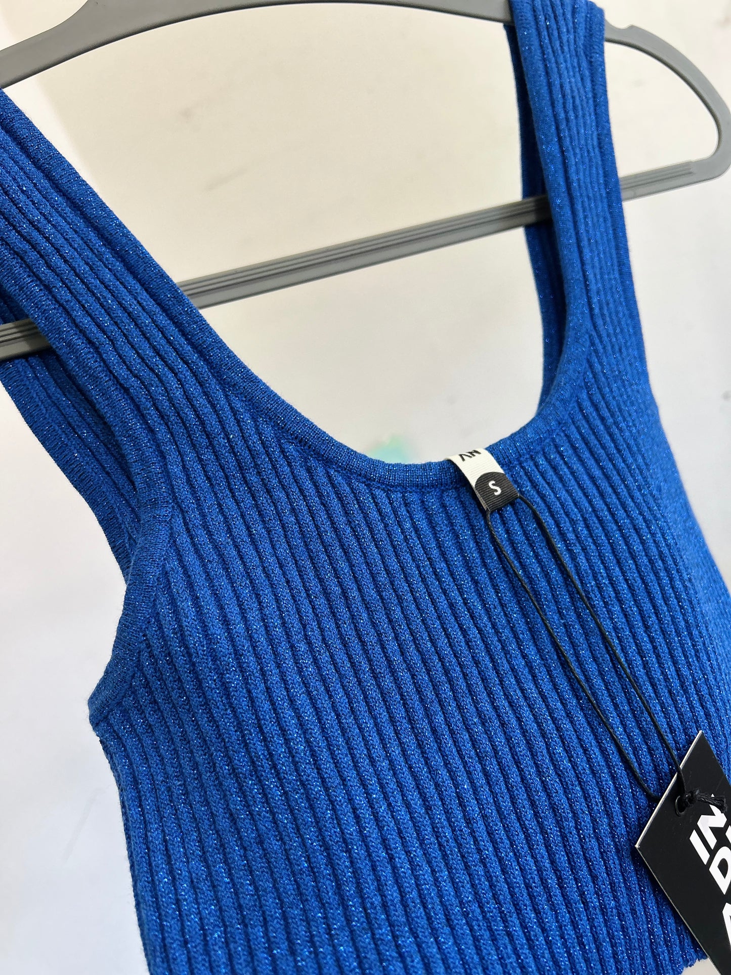 Top brillos con etiqueta TS